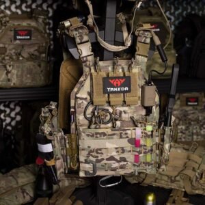 Camouflage VT-6026-1 plate carrier displayed with an example equipment setup including communication accessories, shears, glow sticks and a flashlight.