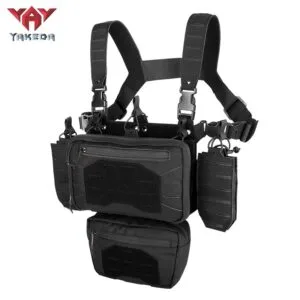 Angled view of black modular tactical chest rig with utility pouch system