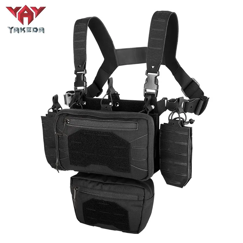 Angled view of black modular tactical chest rig with utility pouch system